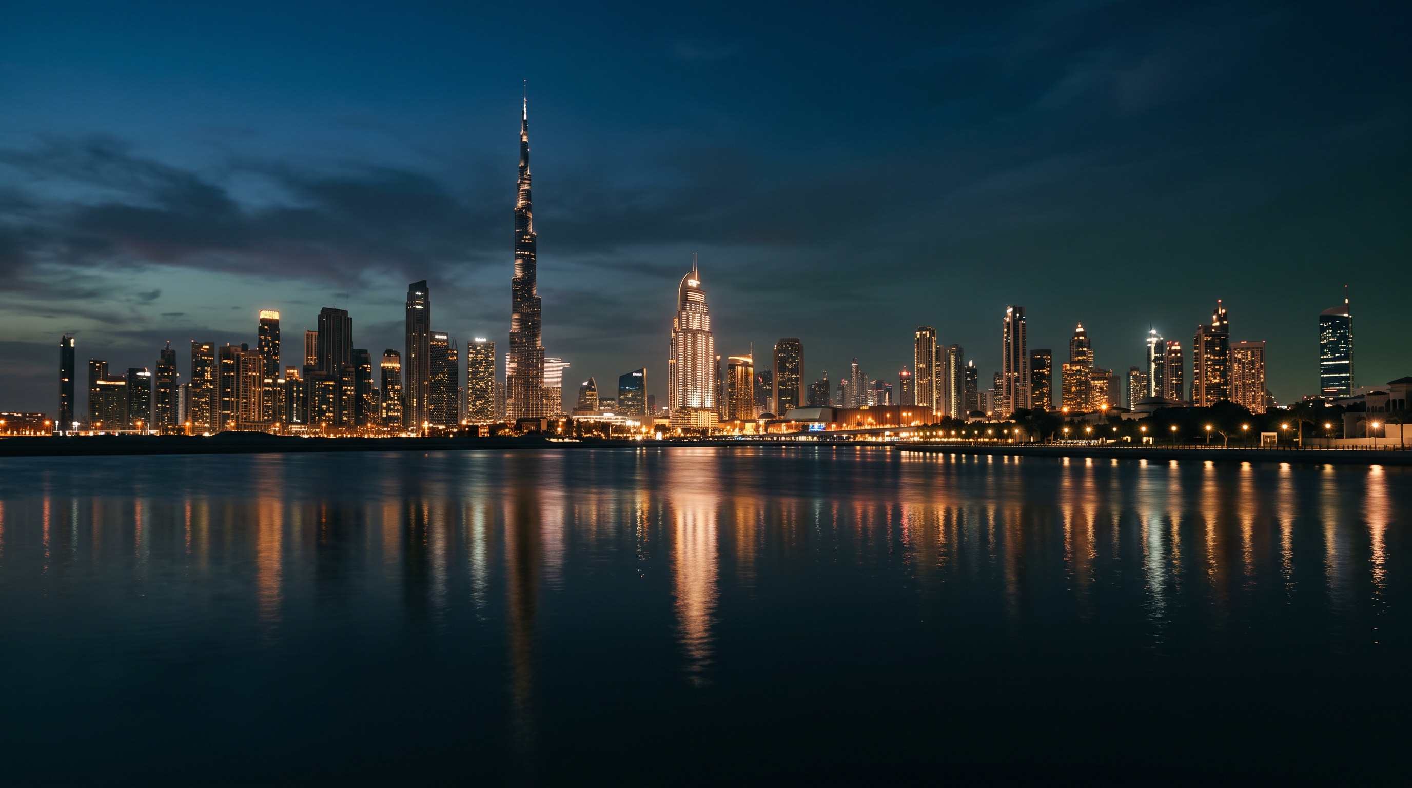 Dubai skyline at dusk across dark water